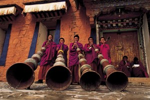 Music lesson for Labrang's monks using the traditional 13-foot horns. Tibet.